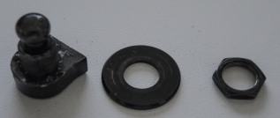 Individual parts of Schaller Strap Lock: Locking mechanism, washer and nut (not pictured is the pin)